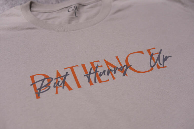 Sand T- Shirt Orange Letters $50